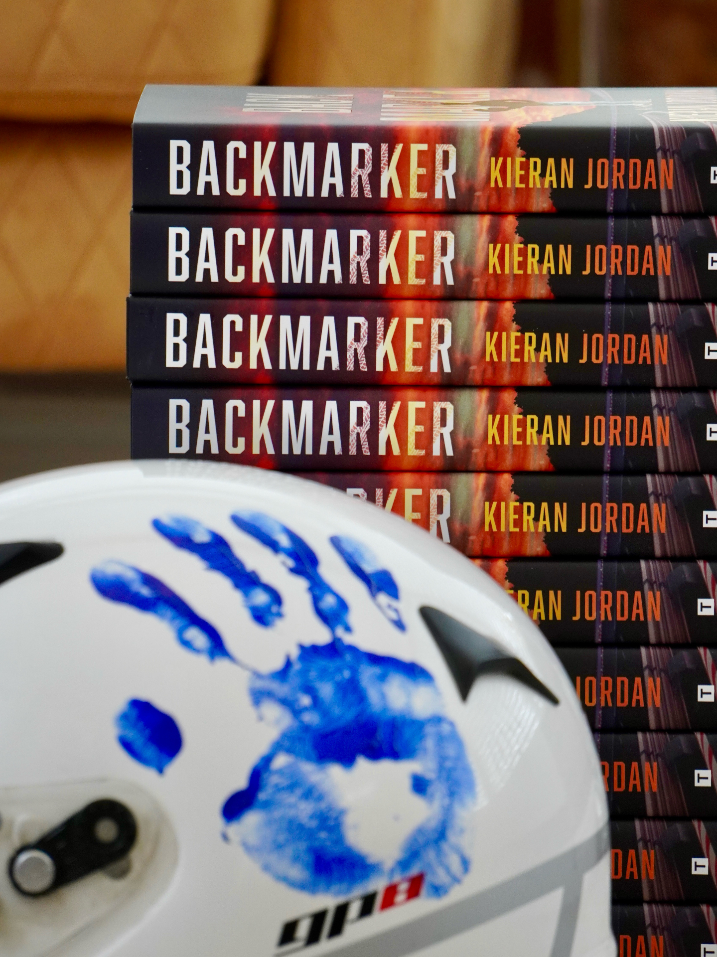 Backmarker books stacked